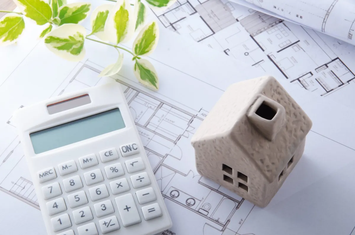 calculator and miniature house