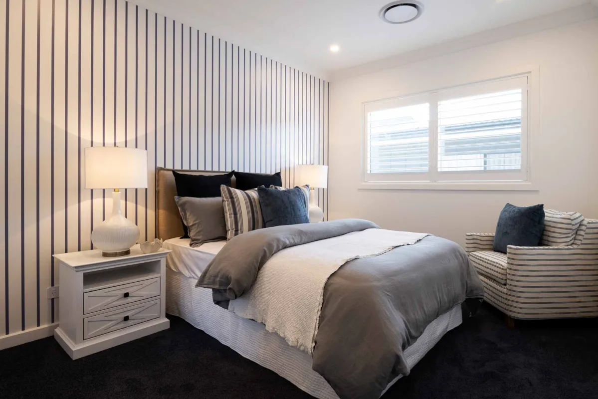 modern guest room with striped feature wall