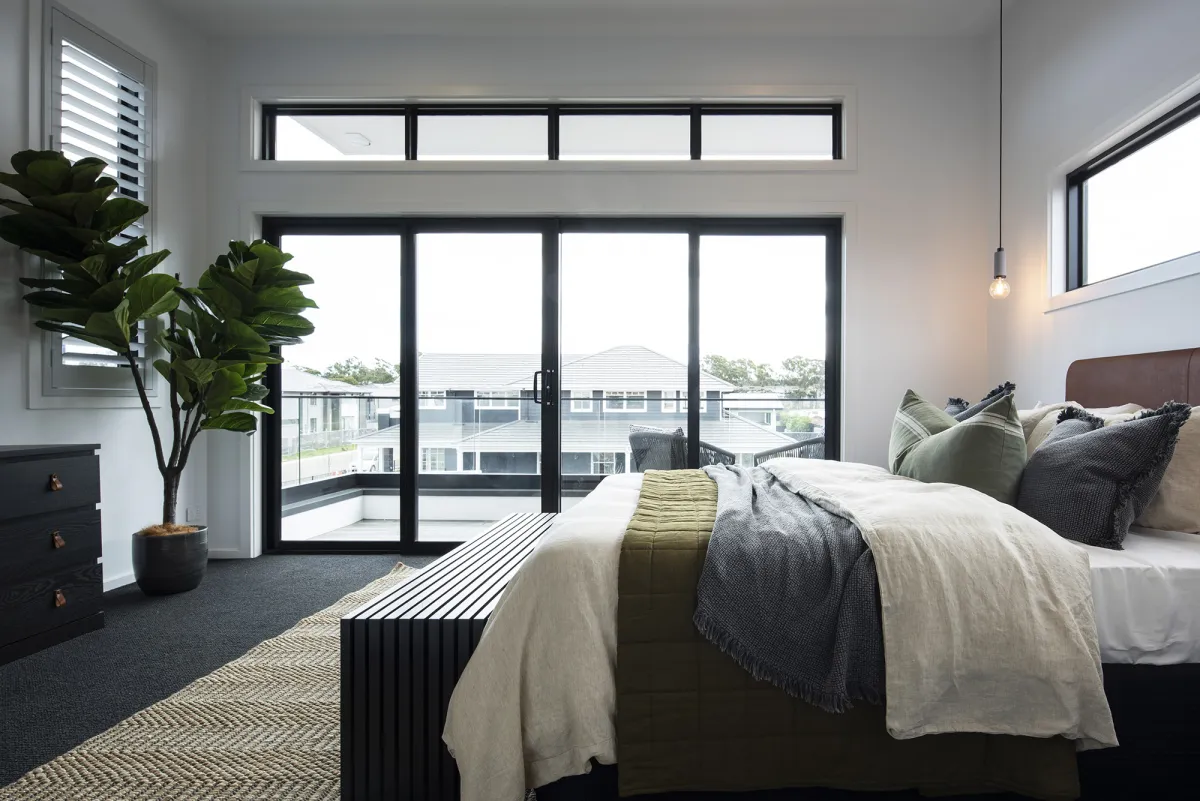 minimalist master bedroom with balcony