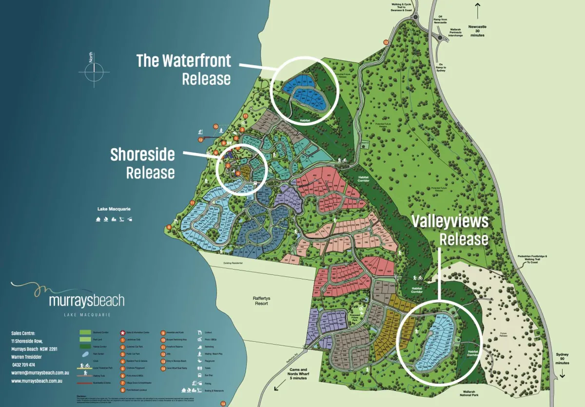 Master plan of Murrays Beach estate at Lake Macquarie showing four residential releases: The Waterfront Release in the north with blue residential lots, Shoreside Release along the western waterfront, Valleyviews Release in the central and eastern areas with red and pink residential lots, and Cams and Norahs Wharf area in the south. Map includes amenities, parks, habitat corridors, walking trails, and distance markers to Newcastle and Sydney