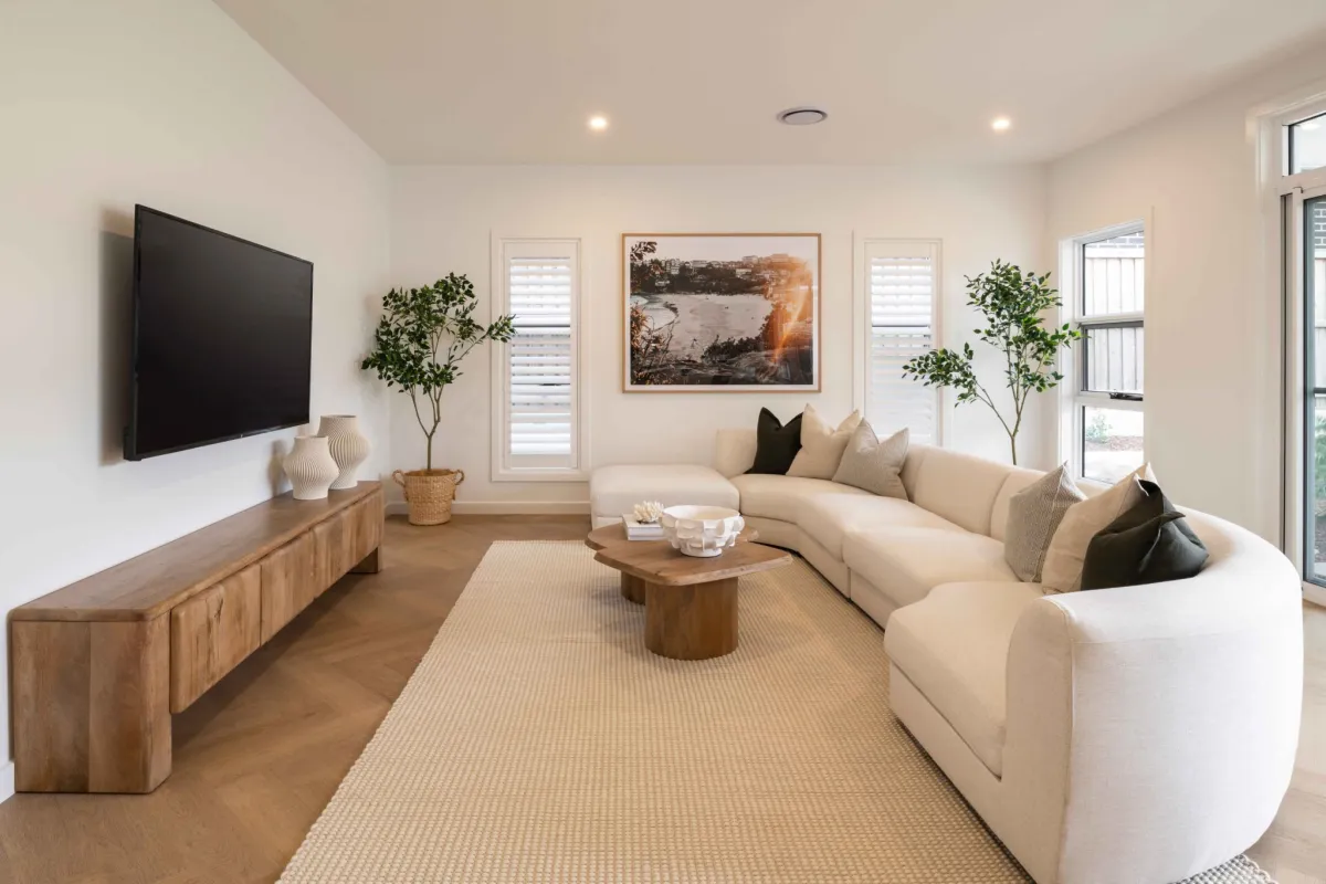 Hamptons-style living room with soft linens and natural timber furniture accents