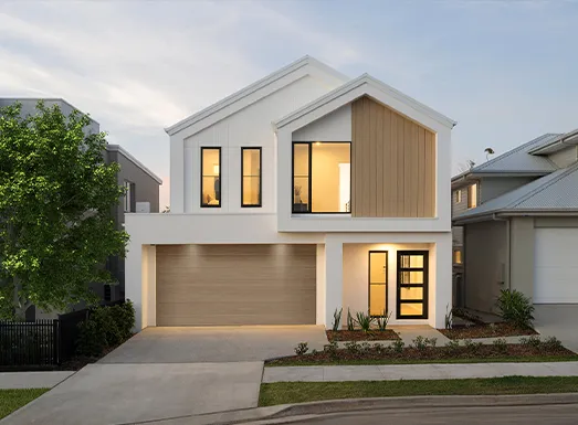 Modern two-story white house with brown trim and garage, featuring large windows with warm interior lighting, manicured front yard with landscaping, and neighboring homes visible, representing a Montgomery residential property.